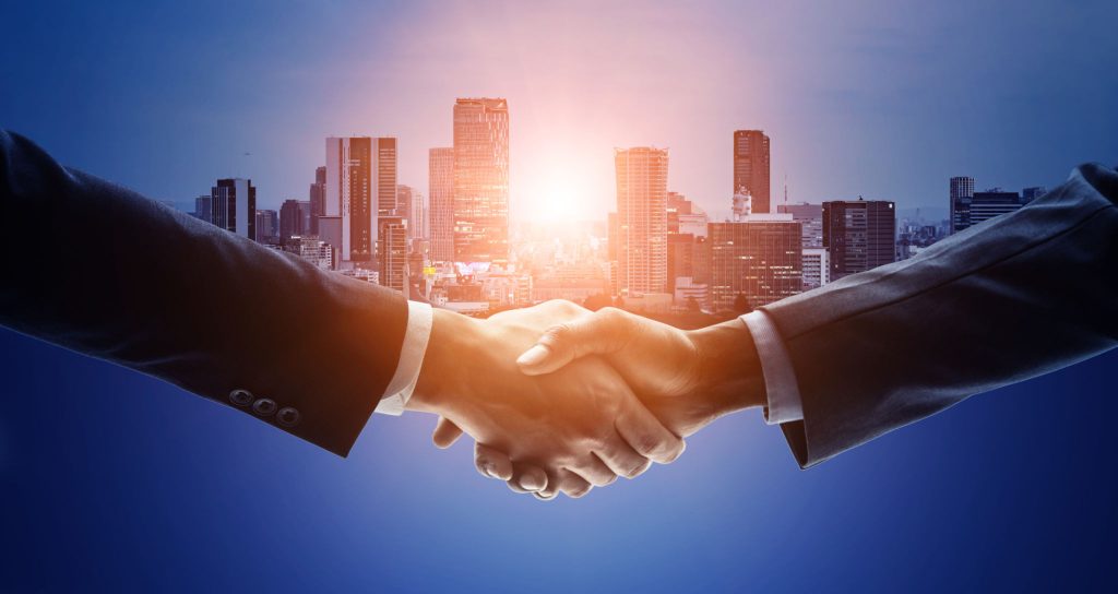 Helping International Organisations with Cyber Security (Shaking Hands)